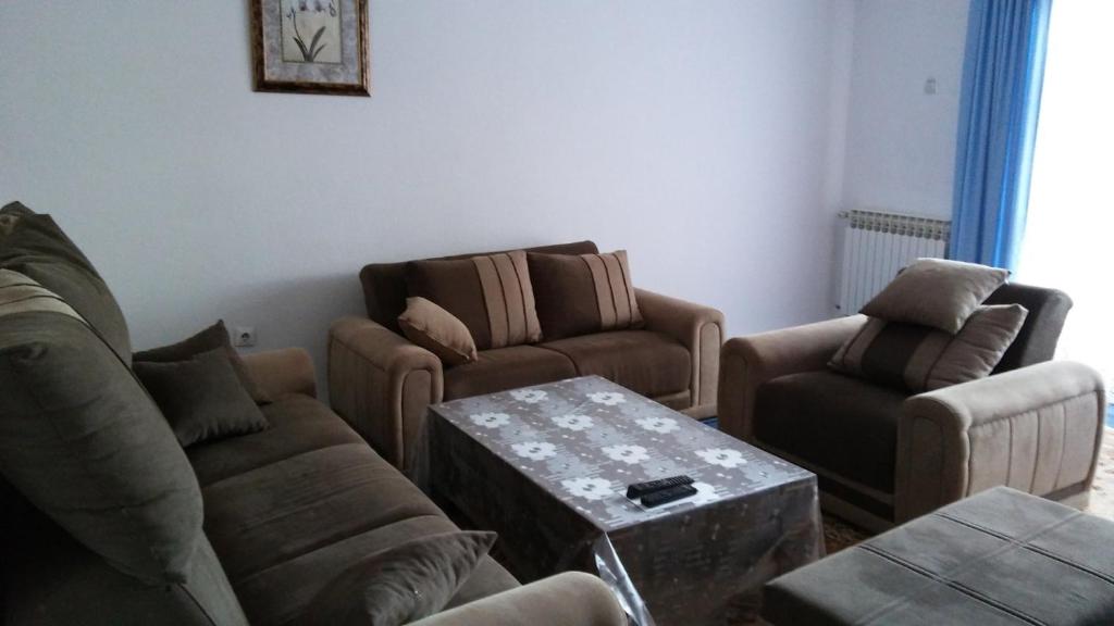 a living room with two couches and a coffee table at House Otes Ilidža in Sarajevo