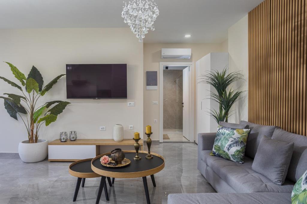 TV a/nebo společenská místnost v ubytování Marquise Residences by Estia