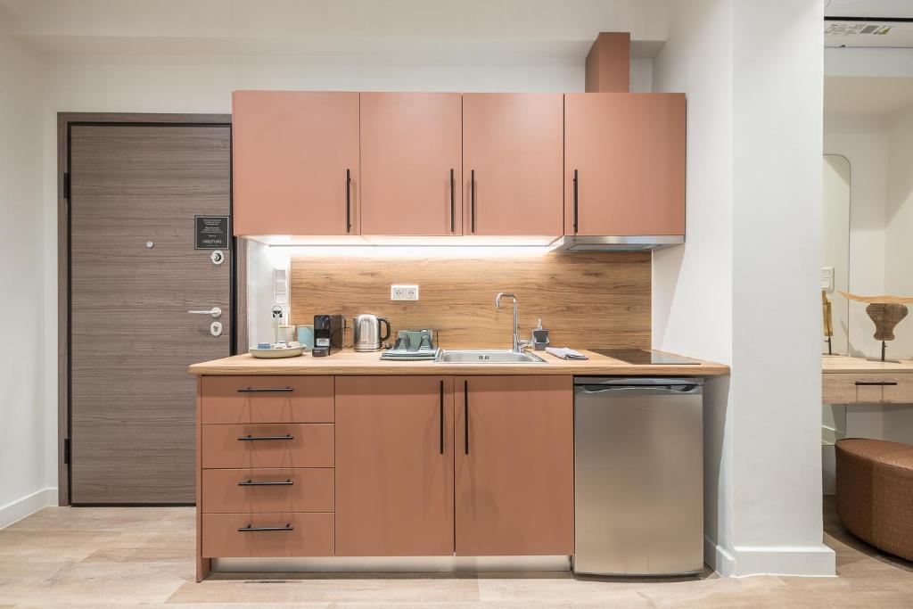 Kuchyň nebo kuchyňský kout v ubytování Aeiphoria Suites & Rooms - Athens