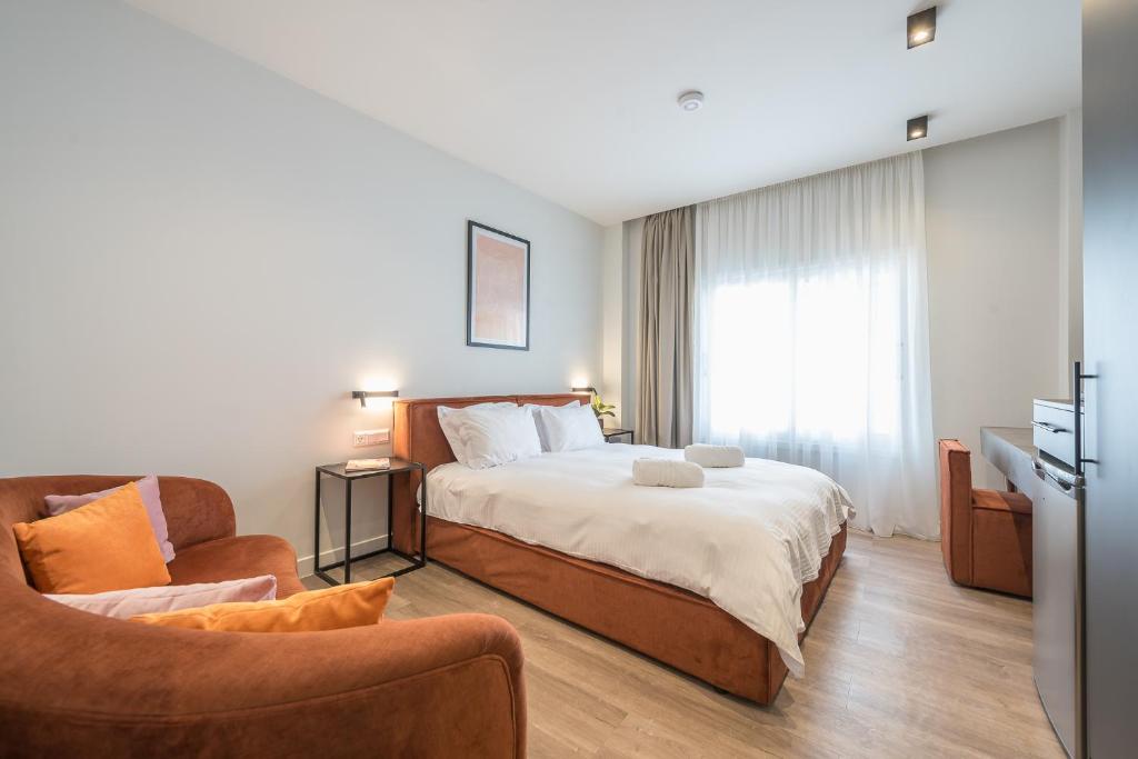 Postel nebo postele na pokoji v ubytování Aeiphoria Suites & Rooms - Athens