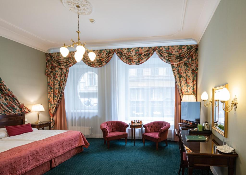 Postel nebo postele na pokoji v ubytování Hotel Liberty