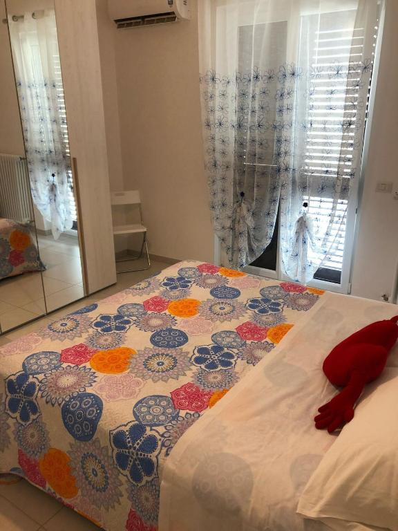 Postel nebo postele na pokoji v ubytování Petali Rosa- Dimora Orizzonte vista mare