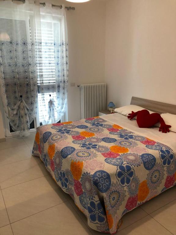 Postel nebo postele na pokoji v ubytování Petali Rosa- Dimora Orizzonte vista mare