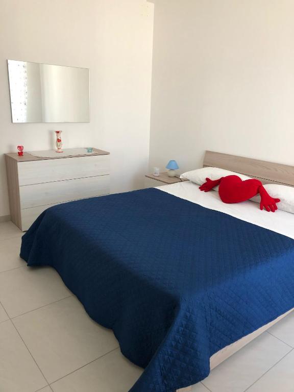 Postel nebo postele na pokoji v ubytování Petali Rosa- Dimora Orizzonte vista mare
