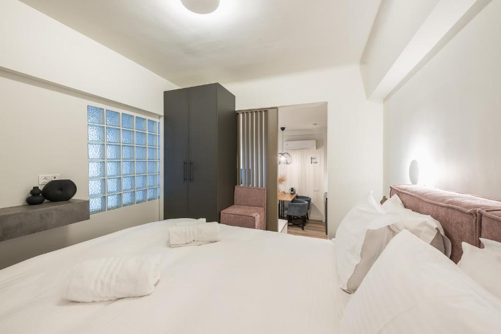Postel nebo postele na pokoji v ubytování Aeiphoria Suites & Rooms - Athens