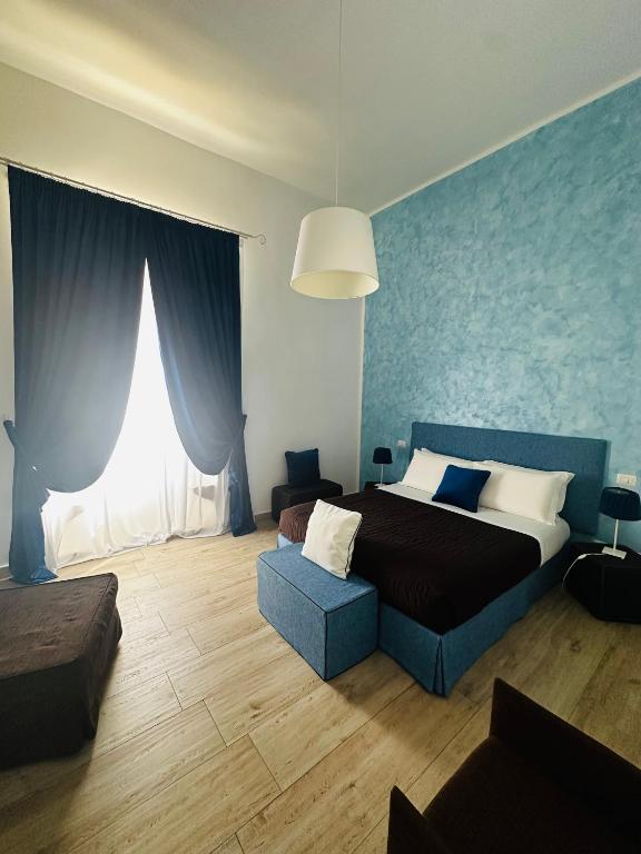 Postel nebo postele na pokoji v ubytování B&B Sigò