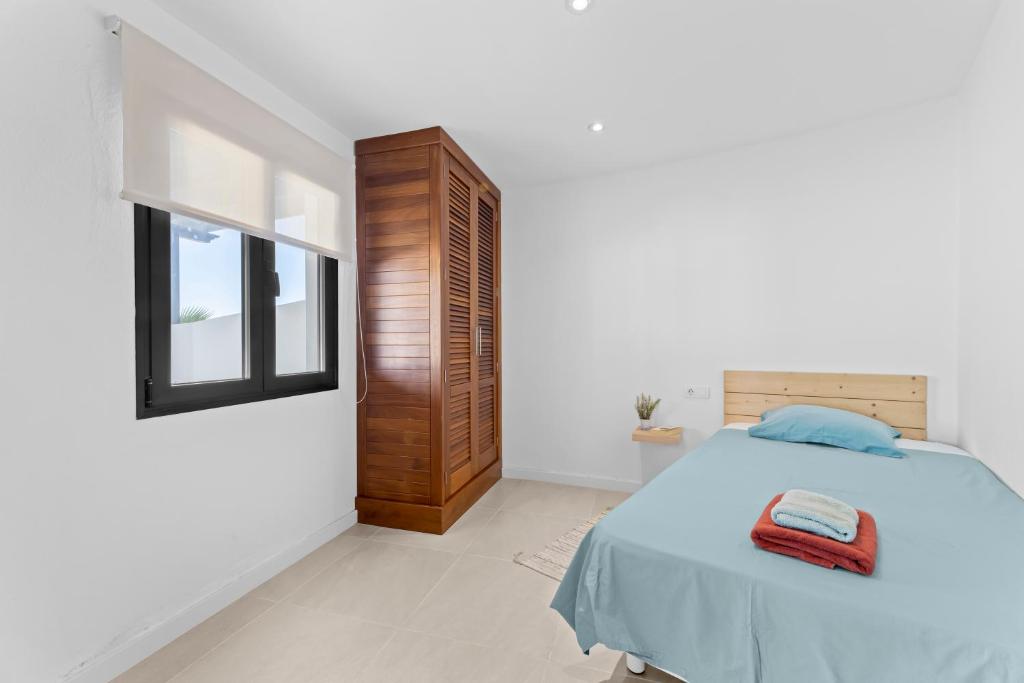 A bed or beds in a room at Casa Marina with pool, garden and terrace