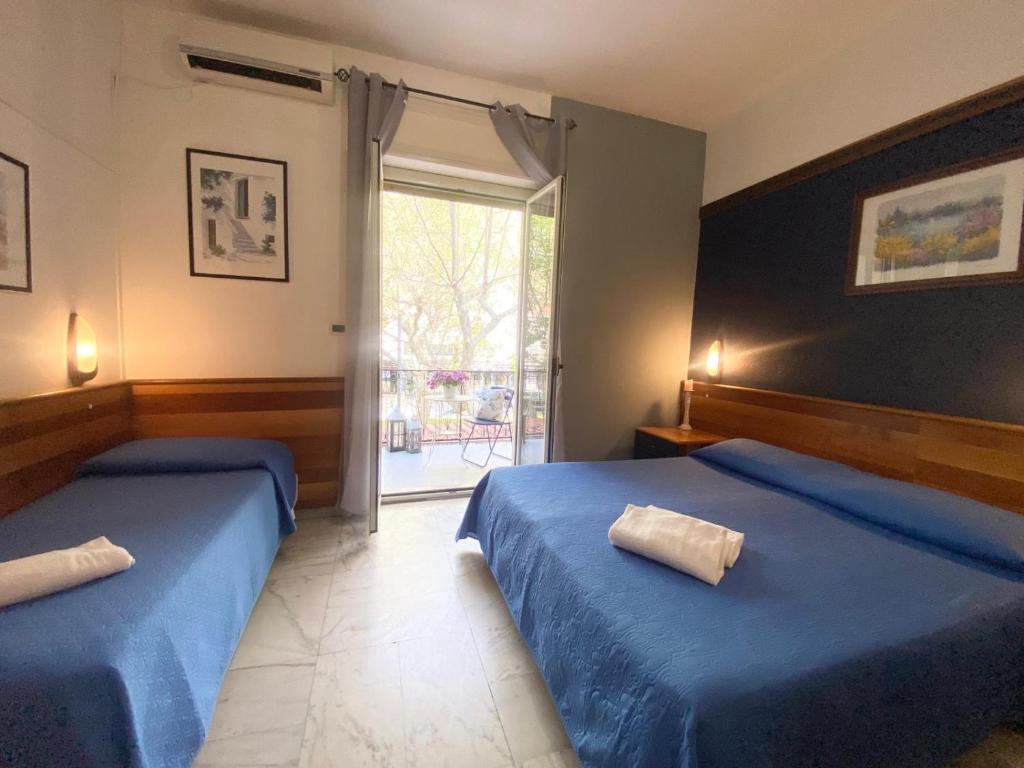 Postel nebo postele na pokoji v ubytování Hotel Praja