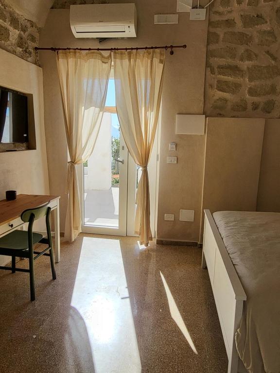 Postel nebo postele na pokoji v ubytování Il Panorama di Ercole