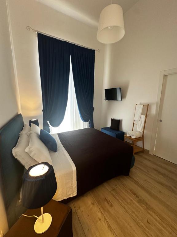 Postel nebo postele na pokoji v ubytování B&B Sigò