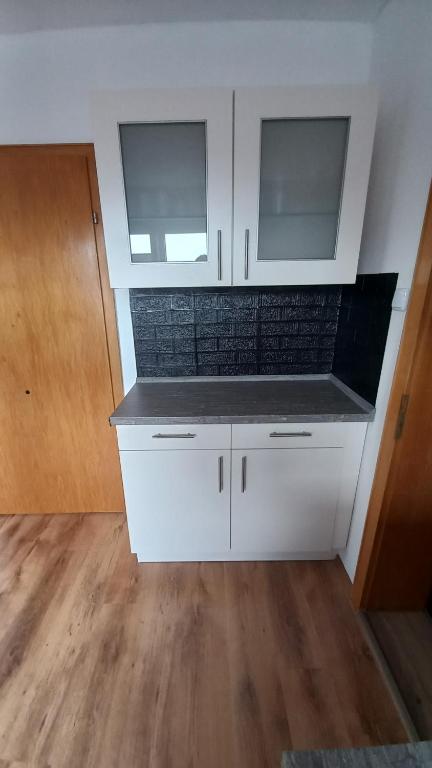 Kuchyň nebo kuchyňský kout v ubytování Ferienwohnung Dschungel