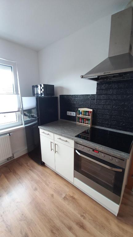 Kuchyň nebo kuchyňský kout v ubytování Ferienwohnung Dschungel