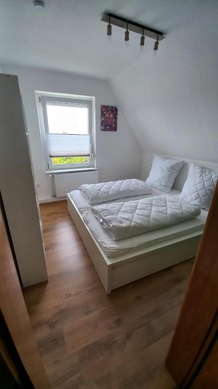 Postel nebo postele na pokoji v ubytování Ferienwohnung Dschungel