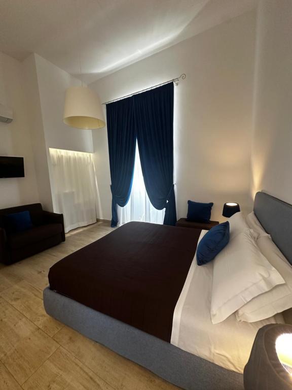 Postel nebo postele na pokoji v ubytování B&B Sigò