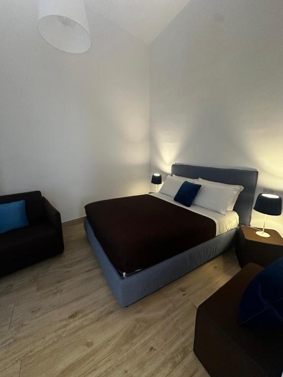 Postel nebo postele na pokoji v ubytování B&B Sigò
