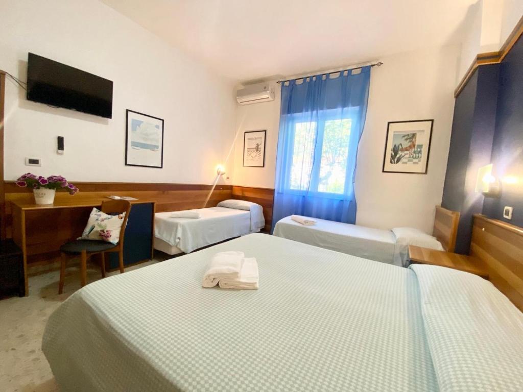 Postel nebo postele na pokoji v ubytování Hotel Praja
