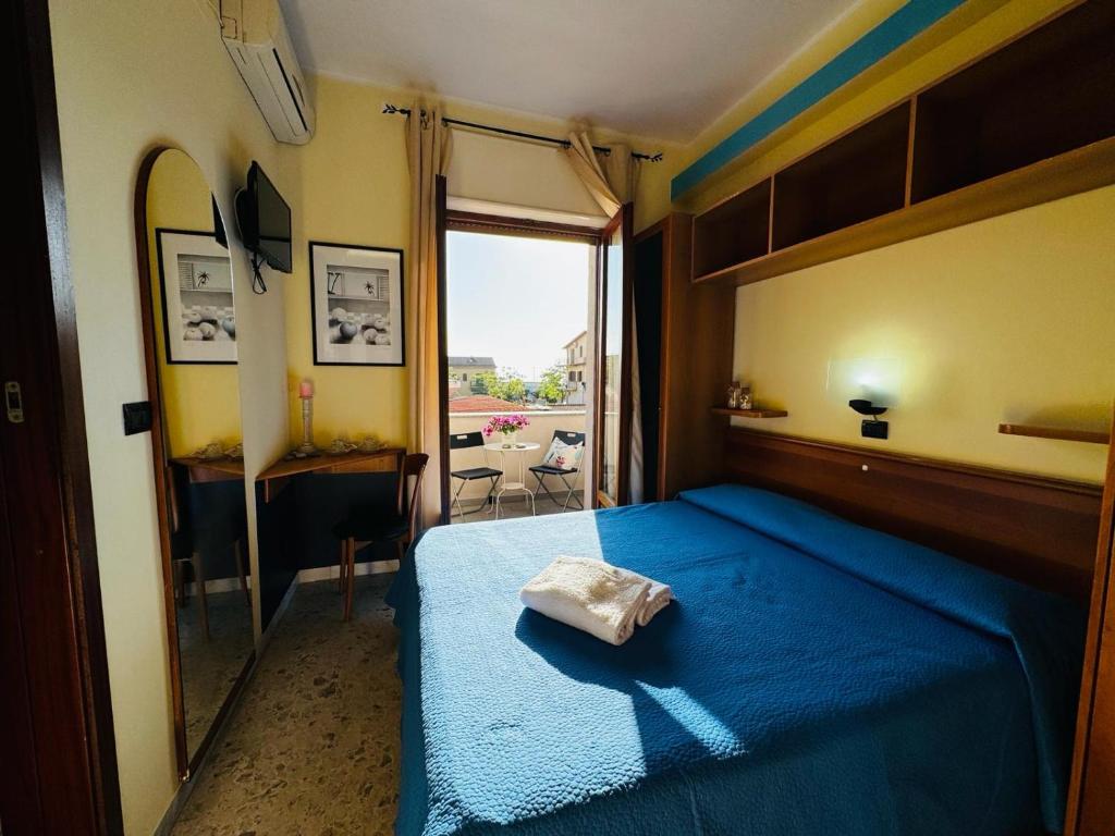 Postel nebo postele na pokoji v ubytování Hotel Praja