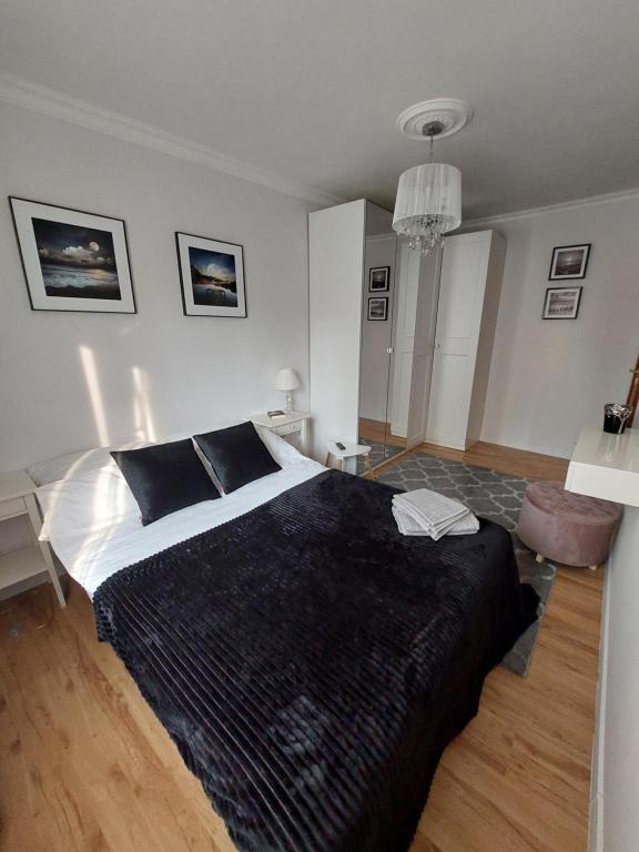 Katil atau katil-katil dalam bilik di Kamieński apartament