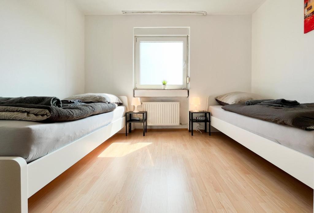 מיטה או מיטות בחדר ב-Home4Now BM01 Komfortable Monteursunterkunft in Bergheim