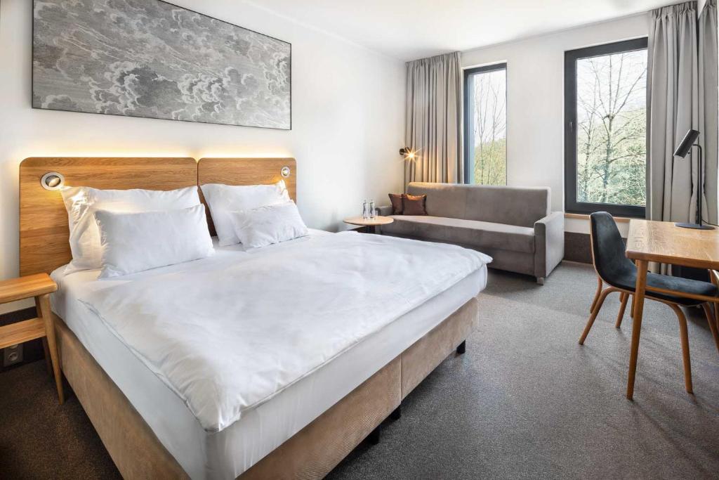 Postel nebo postele na pokoji v ubytování Hotel Golf Prague