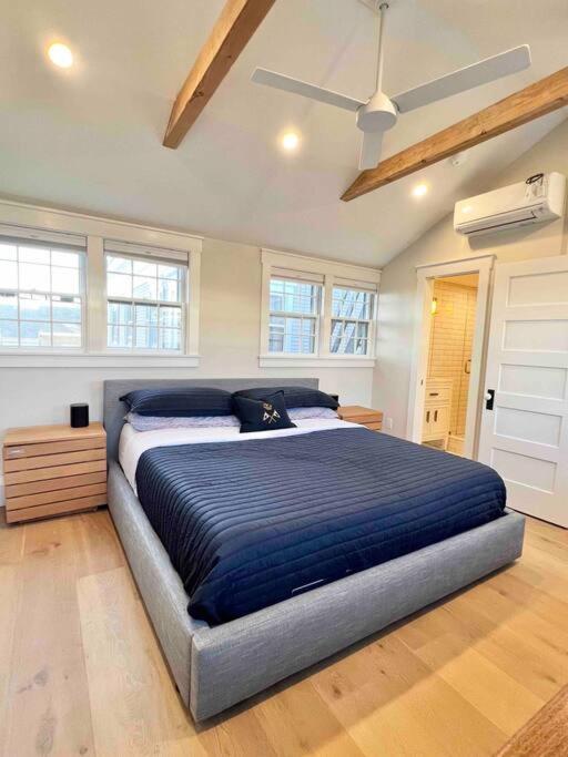 a bedroom with a large bed in a room at Luxury Water-View West End Condo in Provincetown