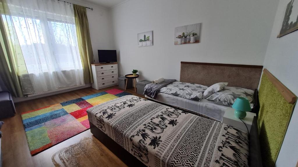 Postel nebo postele na pokoji v ubytování Dunakeszi Nap Apartman