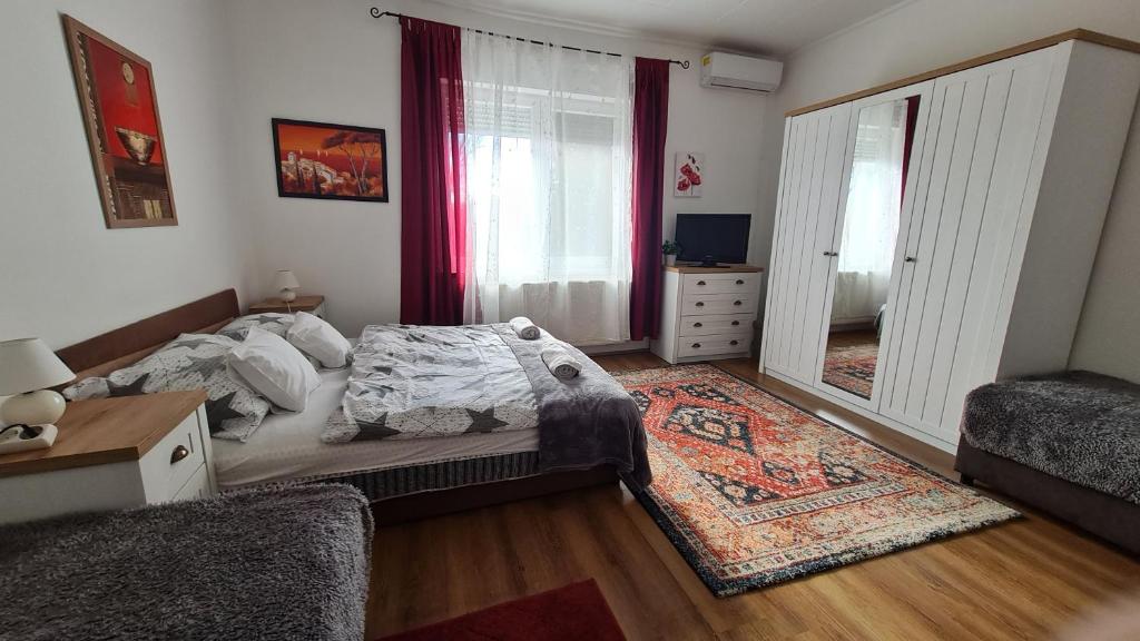 Postel nebo postele na pokoji v ubytování Dunakeszi Nap Apartman