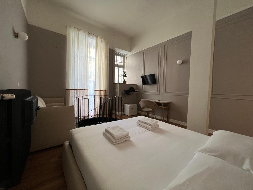Postel nebo postele na pokoji v ubytování Turin Central Cavour