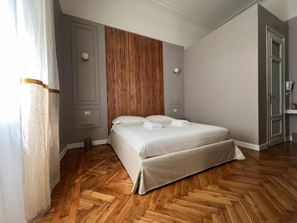 Postel nebo postele na pokoji v ubytování Turin Central Cavour