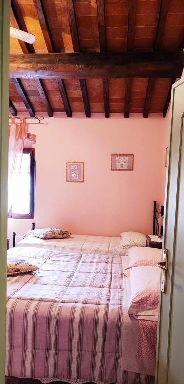 Posteľ alebo postele v izbe v ubytovaní La casa dei nonni