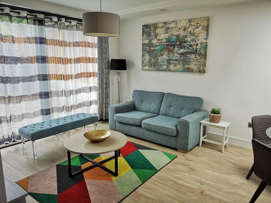 a living room with a couch and a table at Home in Blackrock Dublin in Dublin