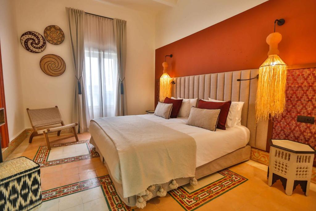 a bedroom with a large bed in a room at Le Palazzo in Essaouira