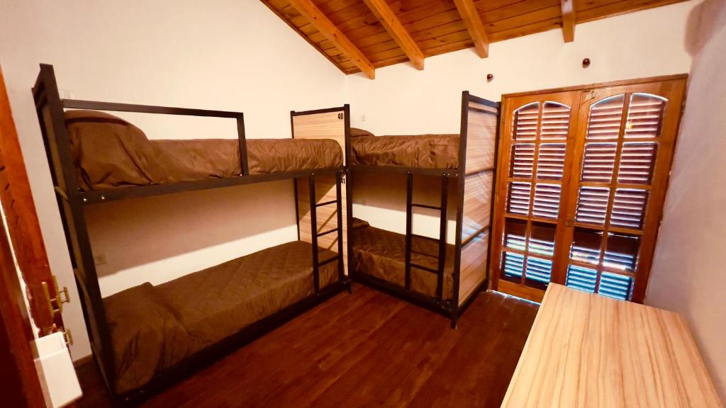 Postel nebo postele na pokoji v ubytování Hostel Falucho