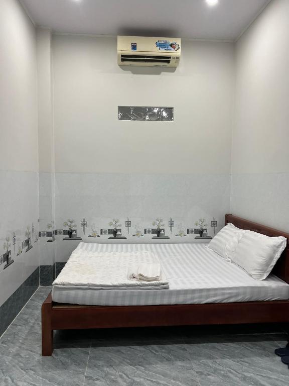 Postel nebo postele na pokoji v ubytování Nhà nghỉ Sunmi