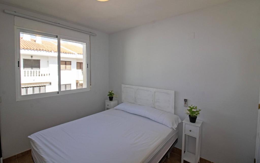 A bed or beds in a room at Tres Playas Primera línea de mar - ALBERT VILLAS Alcossebre