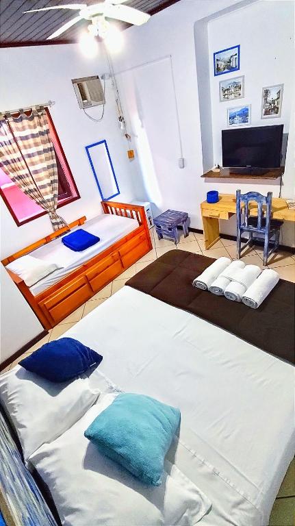 Postel nebo postele na pokoji v ubytování Pousada Lira Praieira Paraty
