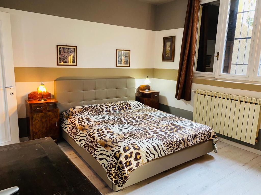 Postel nebo postele na pokoji v ubytování Flat with lake View e Garden