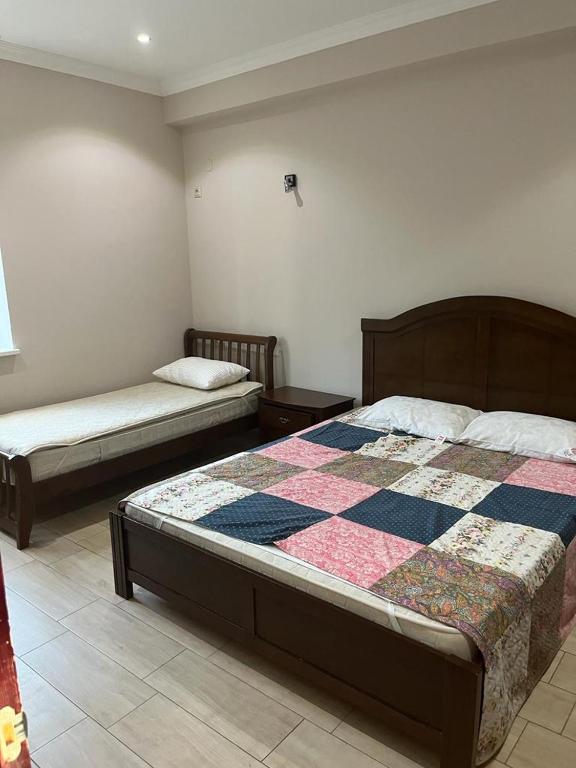 Postel nebo postele na pokoji v ubytování Juz House