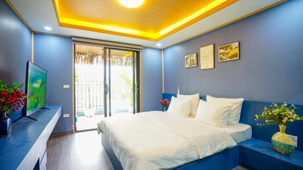 Postel nebo postele na pokoji v ubytování Hanoi Ben's Apartment and Hotel