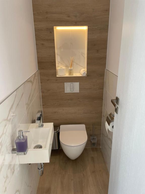 Koupelna v ubytování M26 Prémium apartmanok