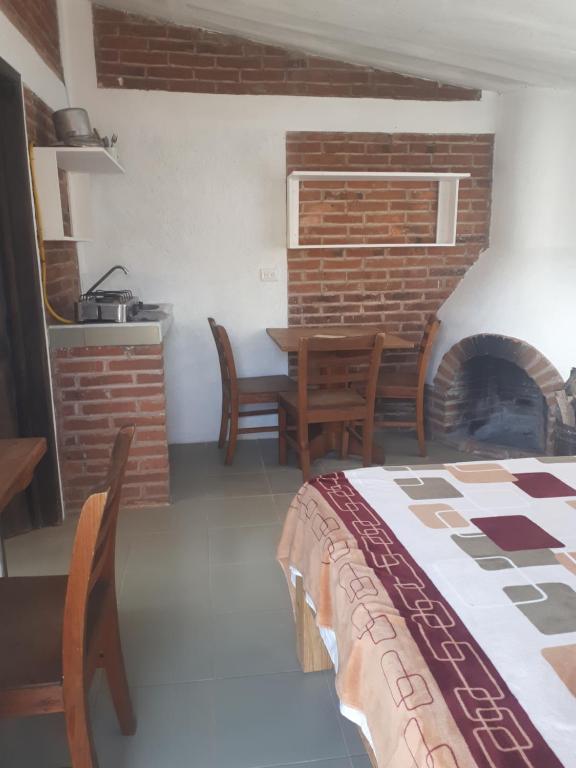 Postel nebo postele na pokoji v ubytování La Misión Cabañas Chignahuapan