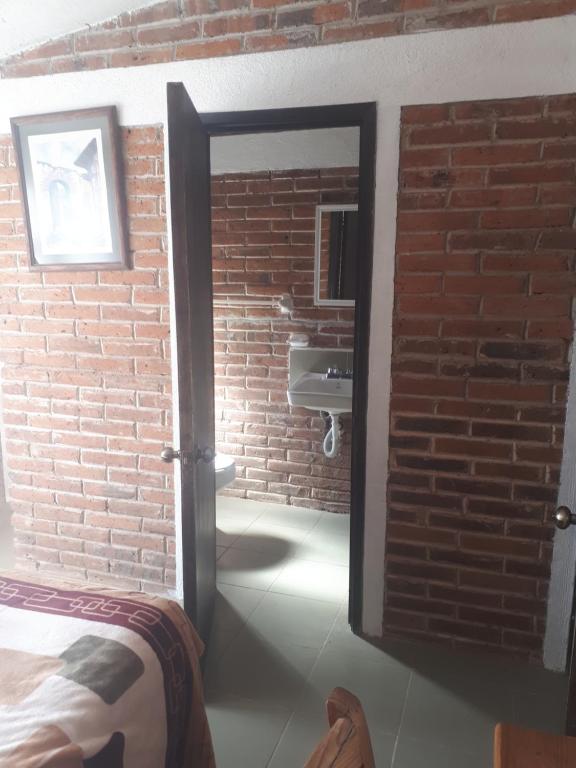 Postel nebo postele na pokoji v ubytování La Misión Cabañas Chignahuapan