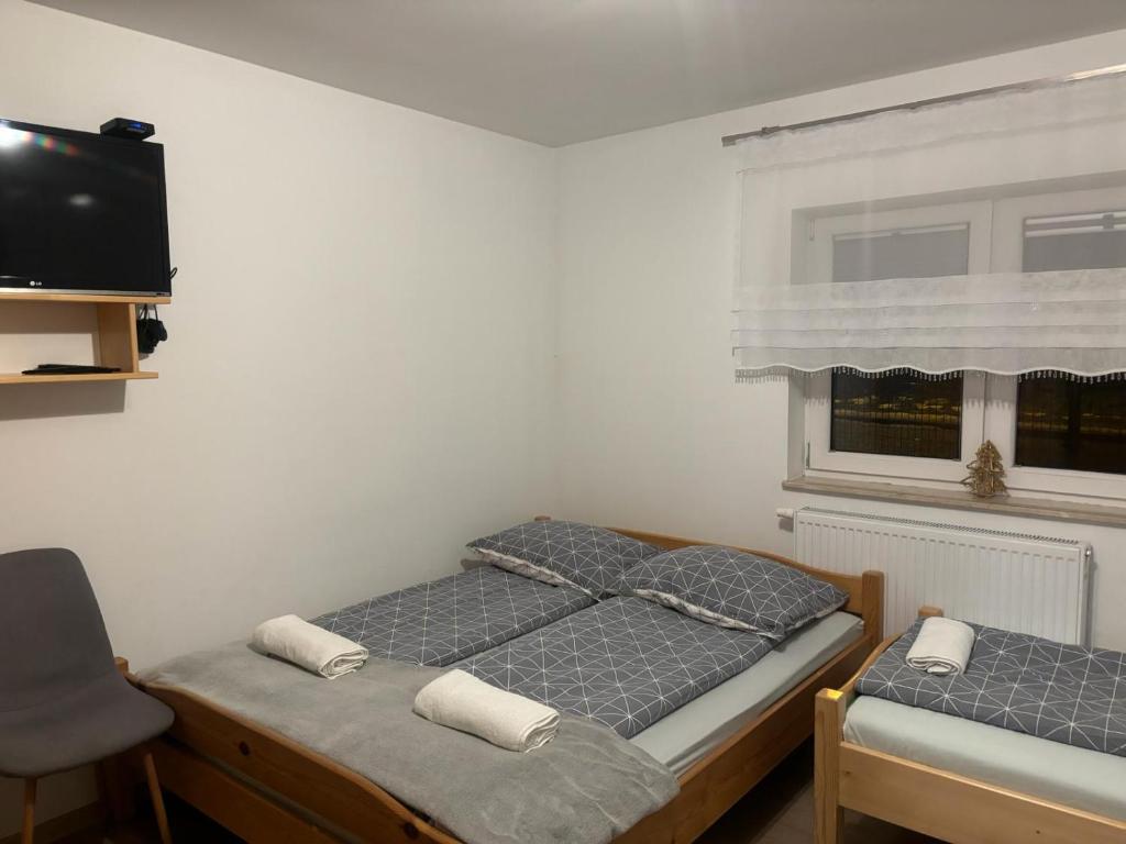 Postel nebo postele na pokoji v ubytování Domek nad Dunajcem