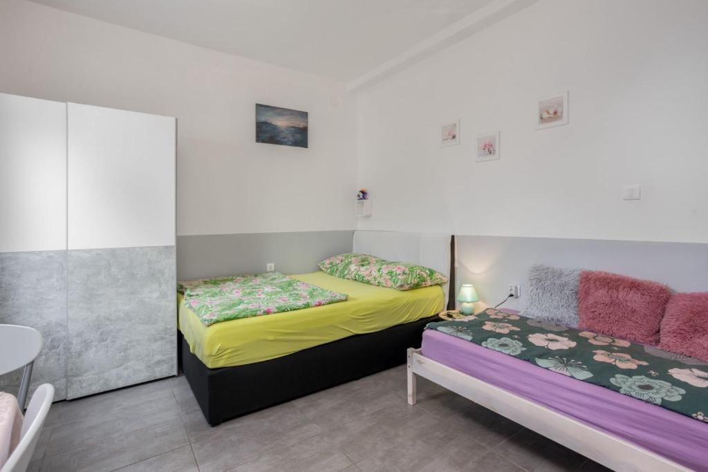 Posteľ alebo postele v izbe v ubytovaní Villa Dora ##3