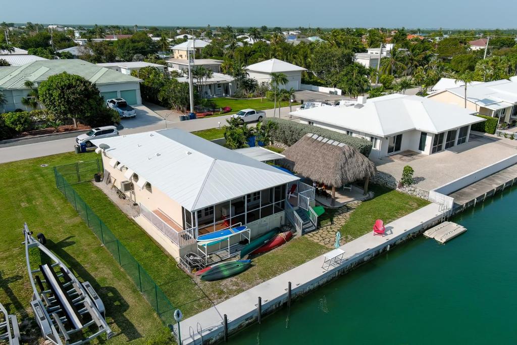 an aerial view of a house next to the water at Tranquility in Paradise - Cudjoe in Summerland Key