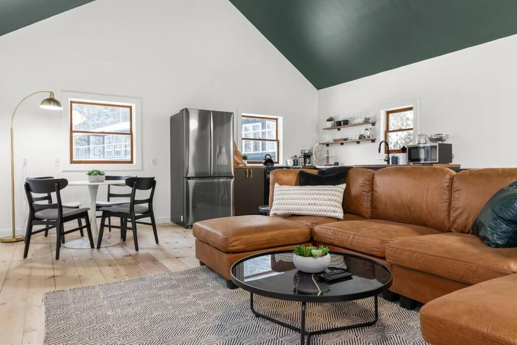 a living room with a couch and a table at Hudson Valley and The Berkshires Cottage in Hillsdale