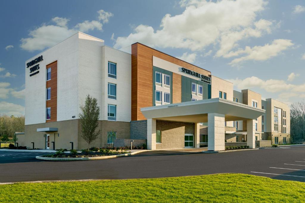 a building with a parking lot in front of it at SpringHill Suites by Marriott Arlington TN in Arlington