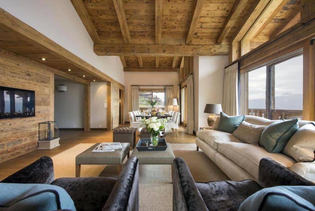a living room with a couch and a table at Luxury Apartment in Crans Montana by Dieckereise in Crans-Montana