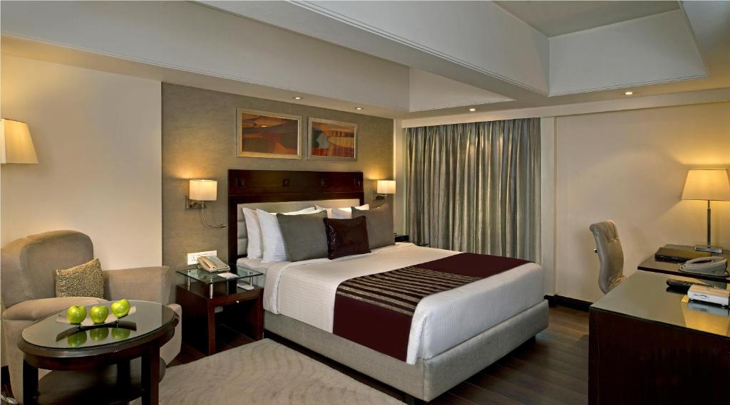 Postel nebo postele na pokoji v ubytování Fortune Park, Ahmedabad - Member ITC Hotels' Group