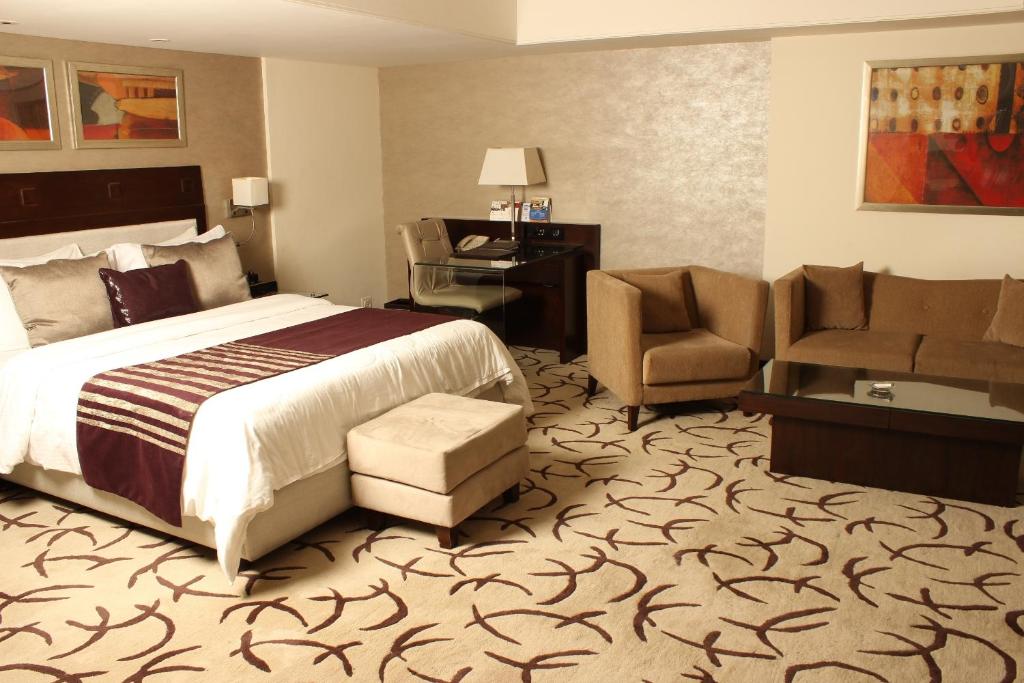 Postel nebo postele na pokoji v ubytování Fortune Park, Ahmedabad - Member ITC Hotels' Group